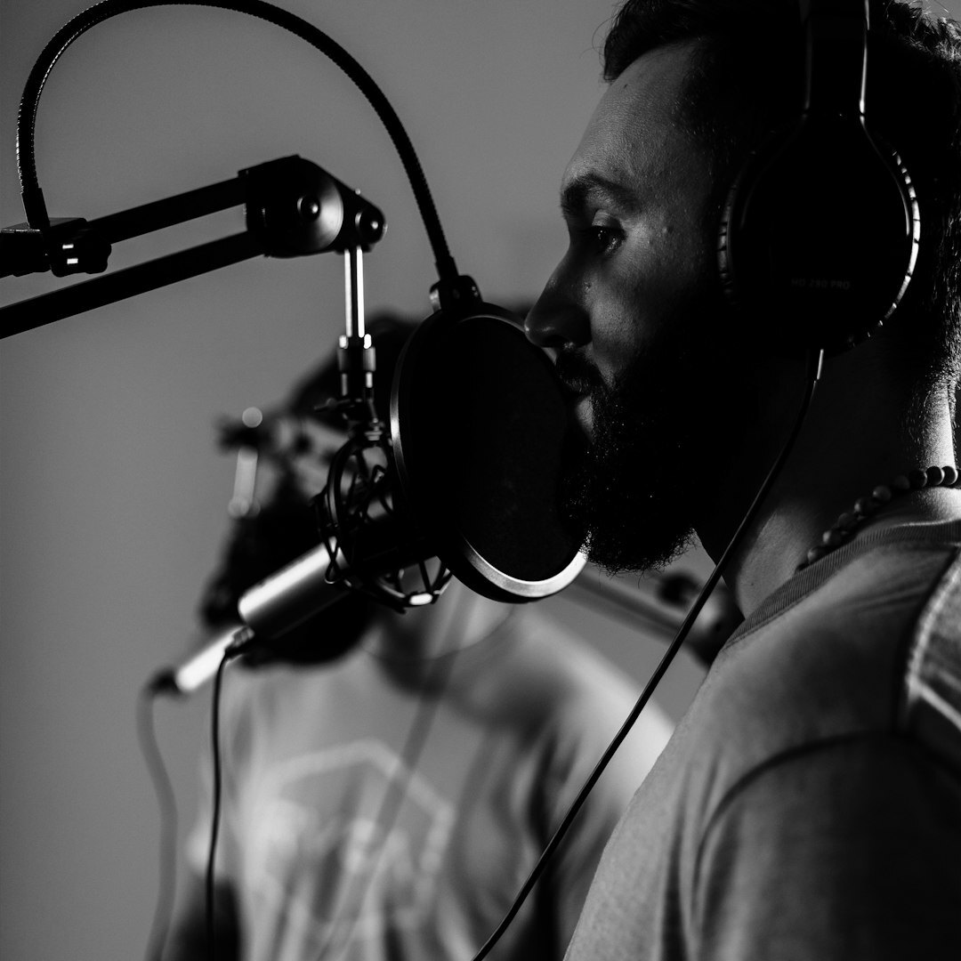 Portrait of a woman wearing headphones in a podcast studio