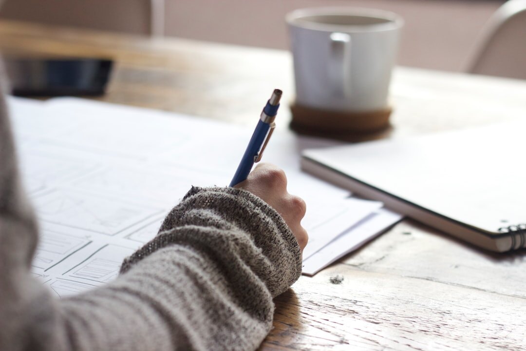 person writing and speaking