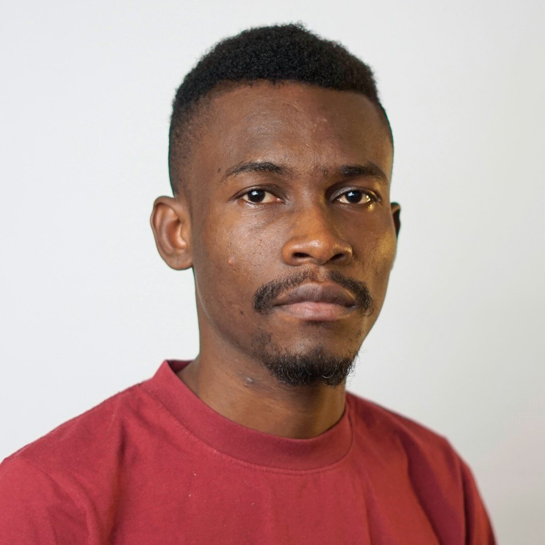 Studio portrait of a young man, editorial team member