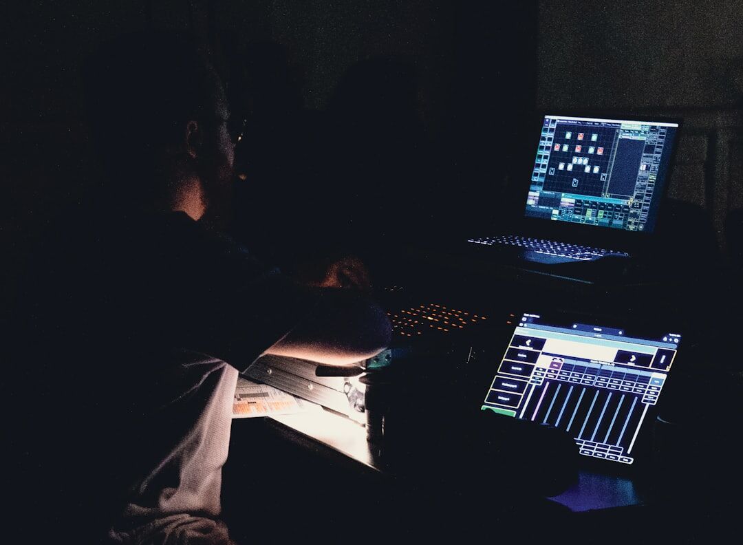 person editing audio on computer