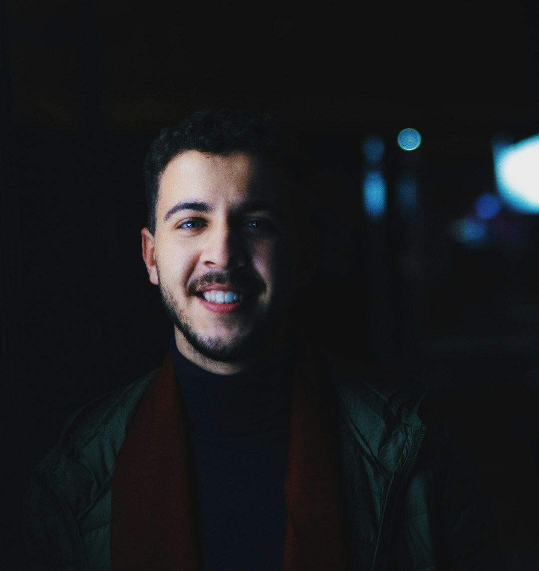 Portrait of a smiling man, podcast listener