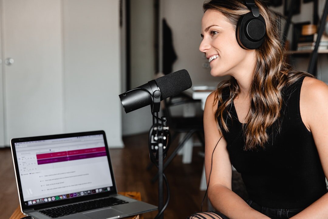 woman recording podcast in studio